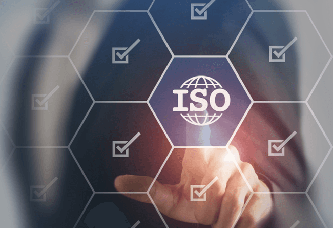 Modern office space with professionals working on quality management systems